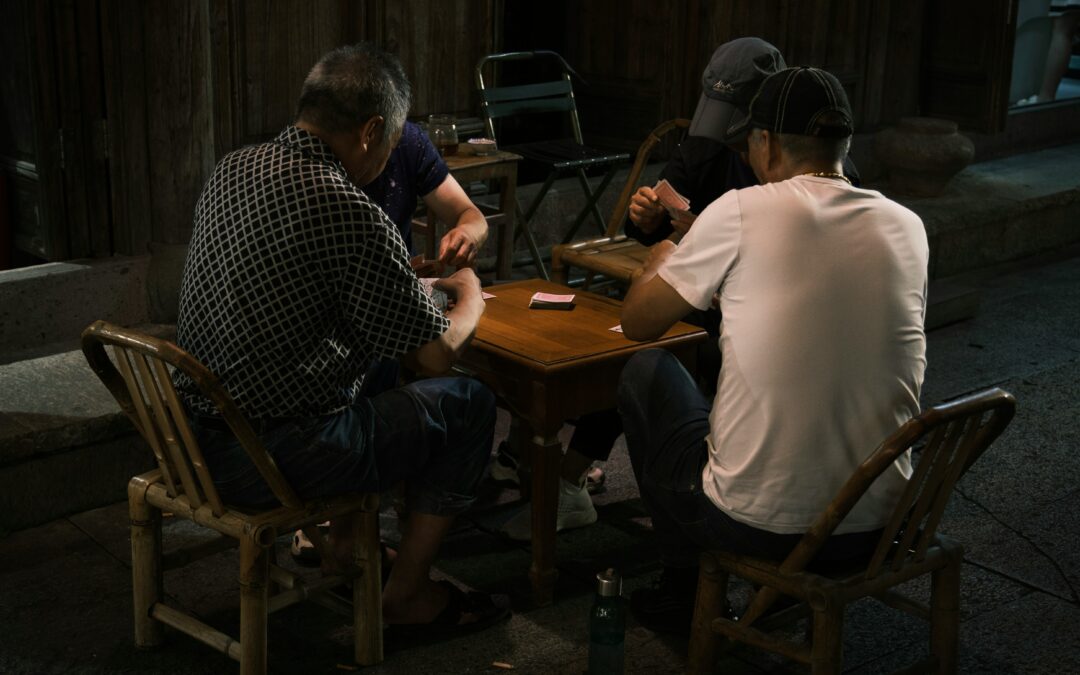 How many people are at a poker table?